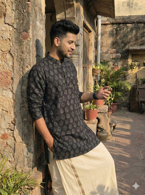 Side profile of the black Adhik Kurta in hand block printed cotton, mandarin collar and long sleeves