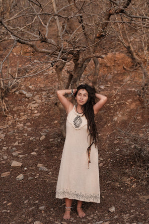 Anuradha beige cotton maxi dress front view, model standing with both hands behind her head