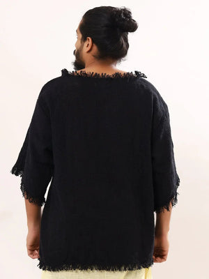 Black baggy knit T-shirt back view on white, raw frayed neckline and drop back hem, visible weave texture