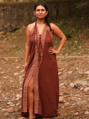Brown Devi Maxi Dress hand block print halter, front pose on forest path