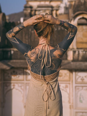 Beige Devi Maxi Dress open back tie detail with arm tattoos, heritage ruin
