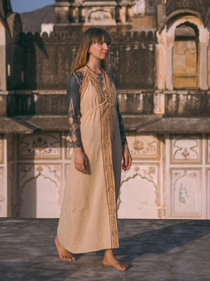 Beige Devi Maxi Dress with layered black top, full length at heritage complex