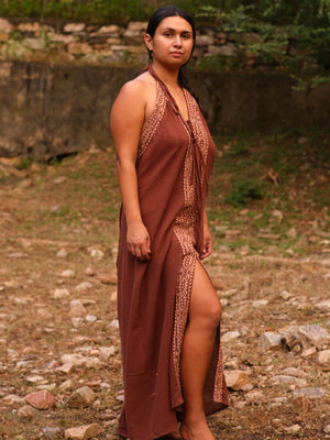 Brown Devi Maxi Dress side slit walk, full length in forest clearing