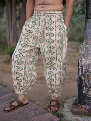 Side view of Kathan harem pants showing the tapered leg, elastic waist and olive green geometric print