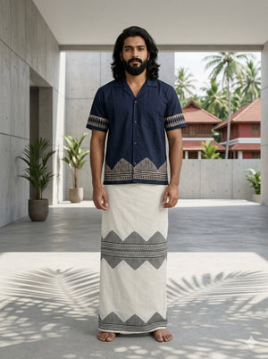 Men's Maruvam indigo geometric print cotton shirt, open camp collar, front view styled with a cream cotton mundu