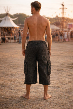 Back view of the cargo jorts worn at festival grounds showing the below-knee length and back pocket