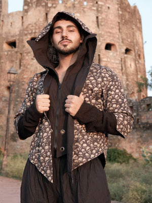 Raaz Jacket unisex skull print hoodie shown front-on with the long hood raised and both hands on the open front