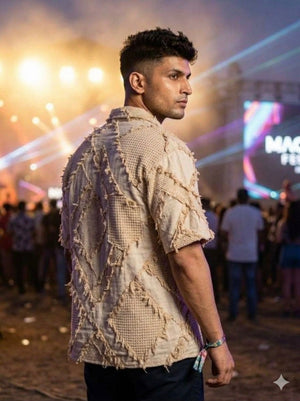 Angled back view of the Raqs distressed patchwork cotton shirt for men, frayed edges