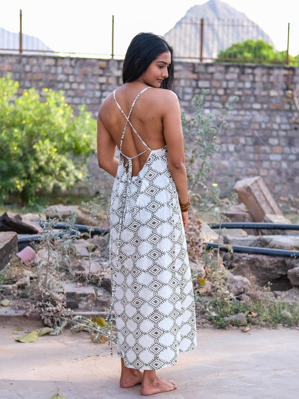 Back view of Sadhana cotton maxi dress showing criss-cross tie-up straps over block print