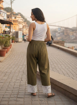 Daksh green double-gauze harem pants with drawstring waist and pockets by Crystal Heal