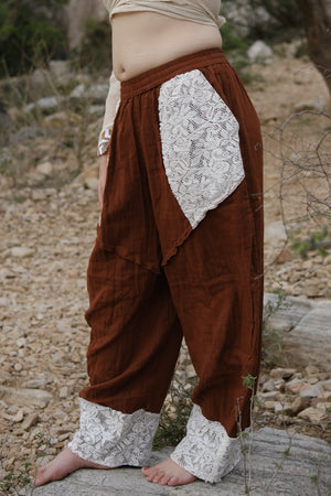 Daksh green double-gauze harem pants with drawstring waist and pockets by Crystal Heal