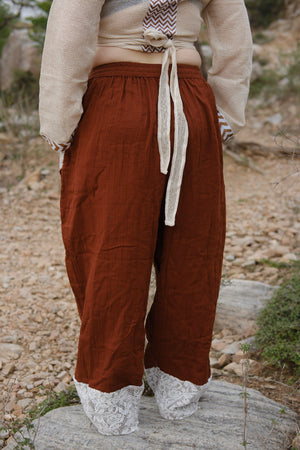 Daksh green double-gauze harem pants with drawstring waist and pockets by Crystal Heal