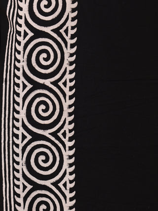 The Tribal Dhoti features a black fabric with a vertical white spiral and zigzag pattern, reminiscent of Rajasthani hand block-print, on the left side. This creates a contrasting and intricate design, echoing the elegance of traditional Indian style.