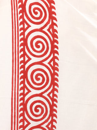 The Tribal Dhoti features a white fabric with a striking red vertical border adorned with intricate spirals and geometric patterns, reflecting the essence of traditional Indian style reminiscent of Rajasthani hand block-print.