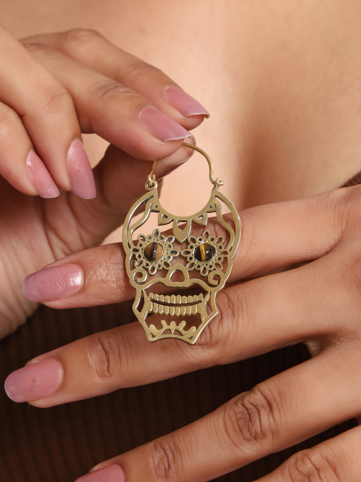 Boucle d'oreille tête de mort