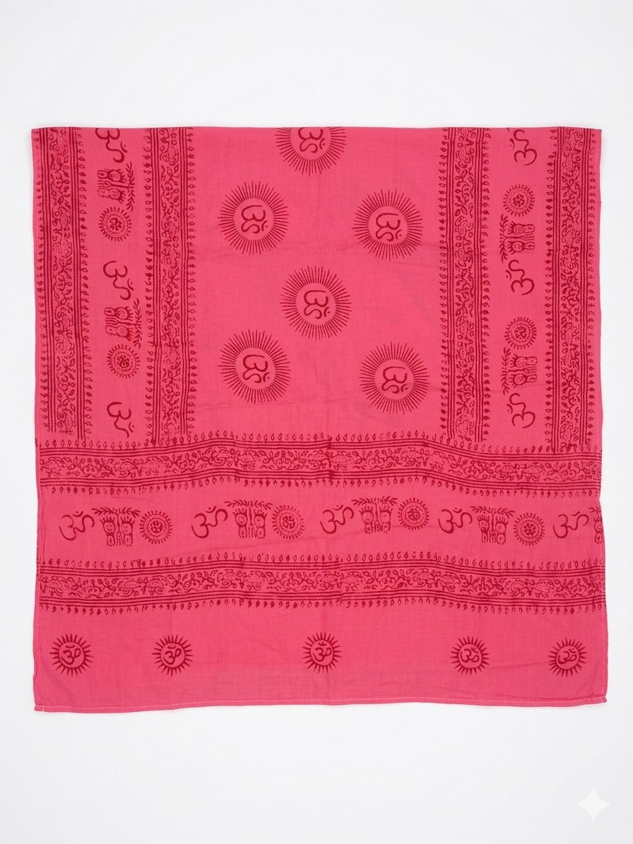 Introducing the Mantra Shawl: a luxurious pink square cloth made from soft viscose, adorned with repeating dark red sun designs and Om symbols in a harmonious, symmetrical pattern. Decorative borders frame the edges, making this exquisite piece ideal for enhancing any outfit as a versatile mantra shawl.
