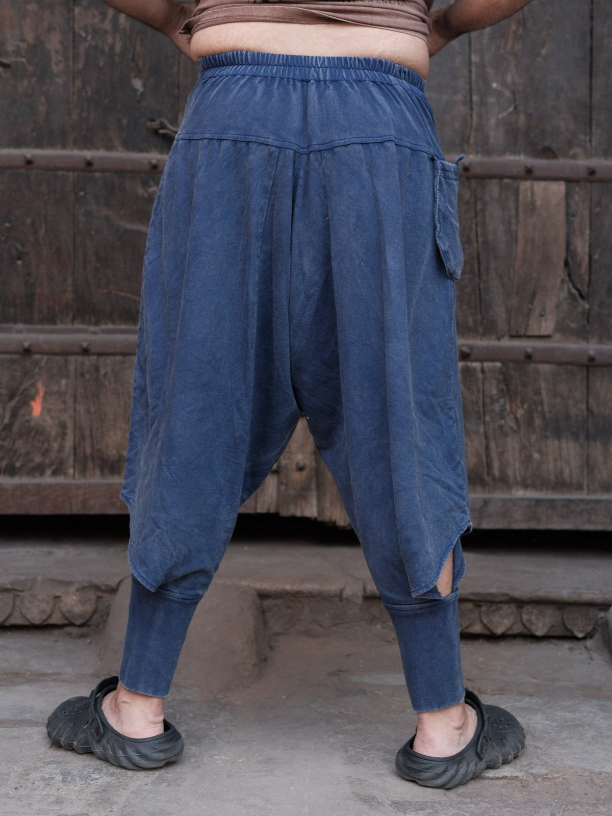 Blue cotton dhoti pants, straight-on back view with gathered waist and cuffs
