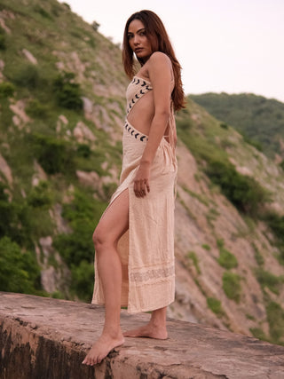 Aadhya cream block print cotton maxi dress on a hillside, hand in hair with the side slit open