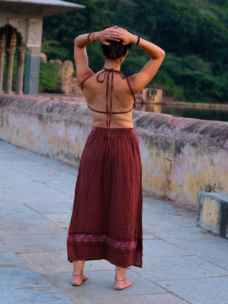 Back view of the Aadhya maroon block print cotton maxi dress showing the halter neck ties and cut-out back