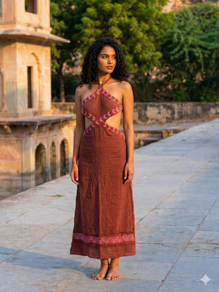 Aadhya maroon block print maxi dress, straight-on front view with hands at her sides on a stone terrace
