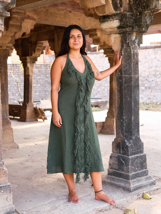 Alaya Dress forest green fringe maxi, model full front view in temple corridor
