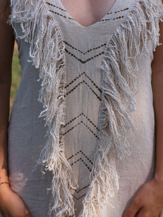 Alaya Dress forest green fringe maxi, side pose against temple pillar