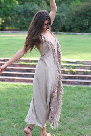 Alaya Dress natural fringe maxi, twirl pose in garden with open back visible