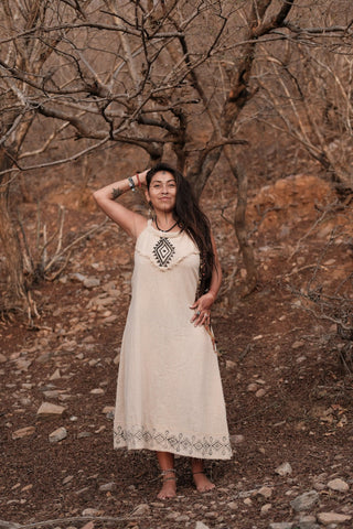 Anuradha cotton maxi dress in motion, model turned to show the flowing flared hemline