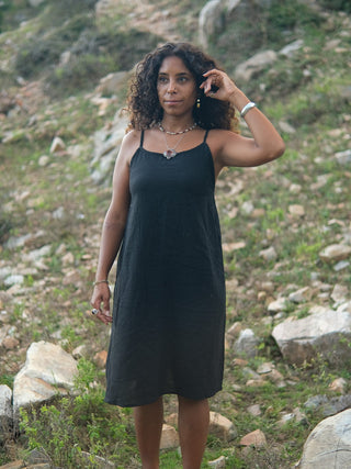 Black handloom khadi cotton slip dress for women, front view outdoors