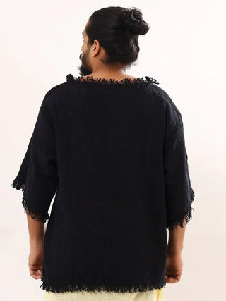 Black baggy knit T-shirt back view on white, raw frayed neckline and drop back hem, visible weave texture