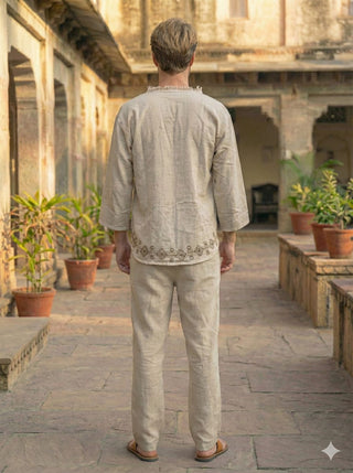 Back view of natural cream baggy kurta with block print hem border and straight trousers