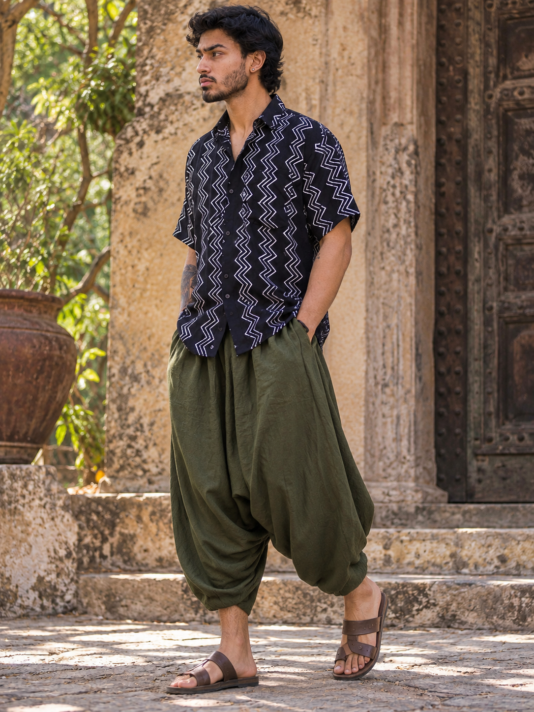 Open collar and fine white zigzag print on the black baggy shirt for men, close front view