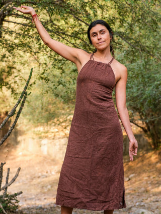 Adina Maxi Dress in deep brown cotton, halter neck maxi with gathered bodice, worn outdoors by a model