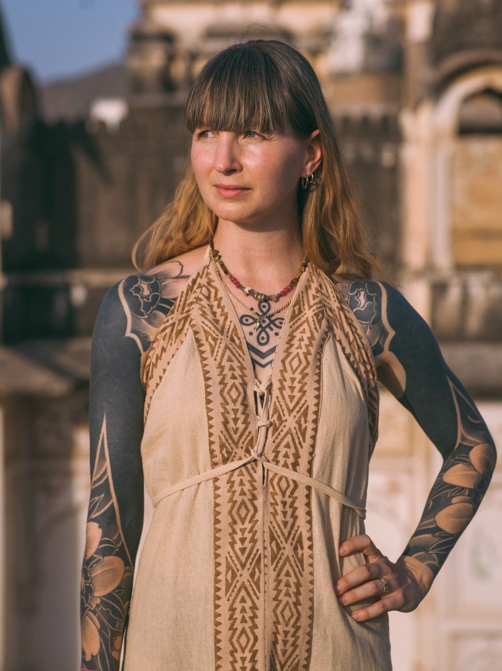 Beige Devi Maxi Dress halter detail with silver jewellery, close crop