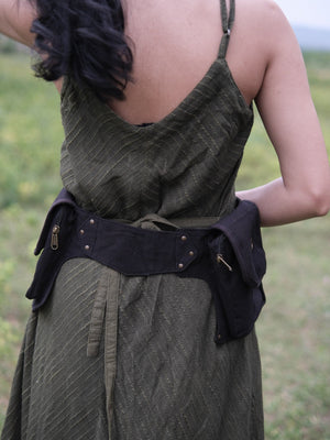 Dhaar Festival Bag fastened around the waist on a model, black cotton belt bag with buckle belt and pockets