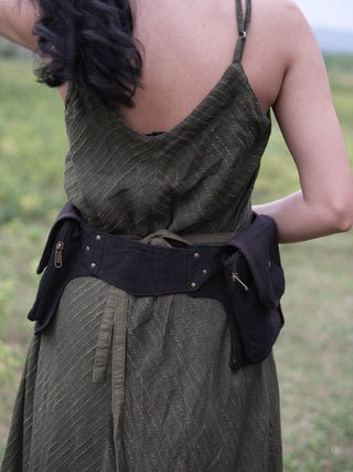 Dhaar Festival Bag fastened around the waist on a model, black cotton belt bag with buckle belt and pockets