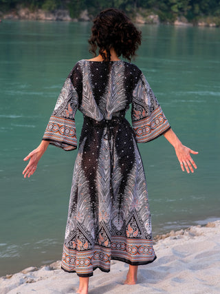 Back view of the Dhaara Maxi Dress, self-tie waist bow and feather print across the yoke
