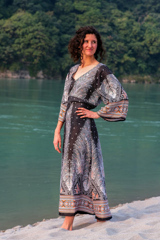 Dhaara black printed cotton maxi dress with hand at the tied waist, flared kimono sleeve visible