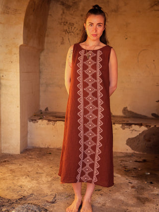 Ekakshi Maxi Dress in brown cotton in a sunlit stone haveli, front view of the cream block print panel