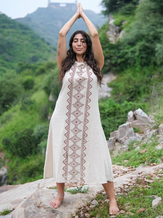 Ekakshi Maxi Dress in natural cotton, arms raised overhead to show the sleeveless straps and print panel