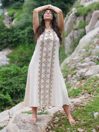 Ekakshi Maxi Dress in natural cotton, hands clasped overhead, showing the sleeveless scoop neckline