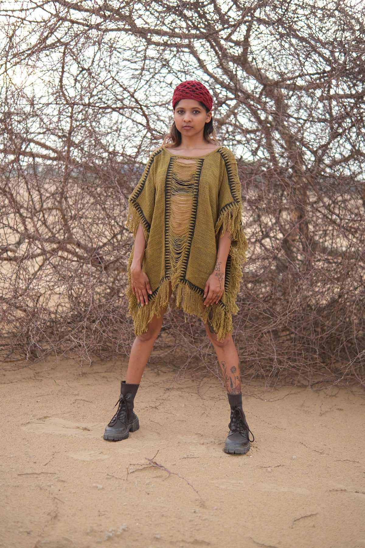 Esha Kaftan in olive green, front view of the black-trimmed fringed neckline