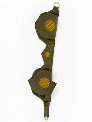 A khaki green, double-cup bra with circular yellow embroidered patches on each cup, metal buckles, and snap buttons is laid flat on a white background—perfect for pairing with the Mystic Waist Belt for a standout rave party look.