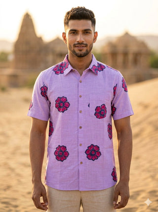 Model wearing the Gul purple floral print cotton shirt for men, buttoned front view, in the Rajasthan desert