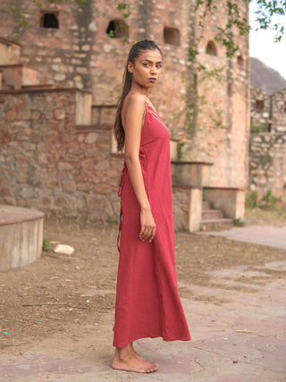Idhika Dress in maroon, side view of the free-size cotton maxi among old ruins