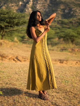 Idhika Dress in olive green, front view of the cotton block print maxi in a golden field