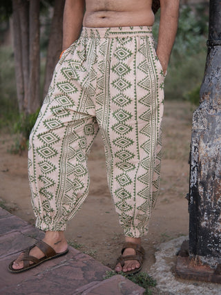 Side view of Kathan harem pants showing the tapered leg, elastic waist and olive green geometric print