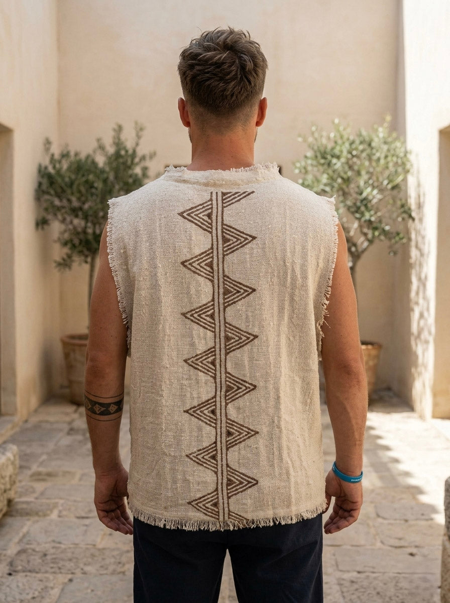 Back view of the Kosha Vest, hand block printed zigzag column down the spine, raw frayed hem, navy trousers.