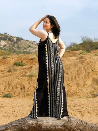 Back view of the Lakeer black khadi cotton maxi dress with ivory chevron stripes and cross straps at the back