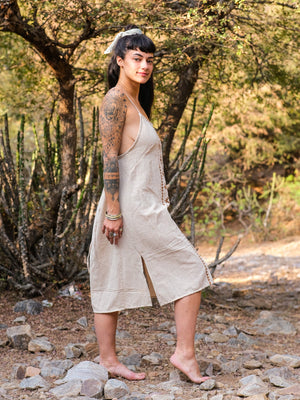 Barefoot model in the Lina Dress showing the relaxed free size fit and the rust block print panel down the front